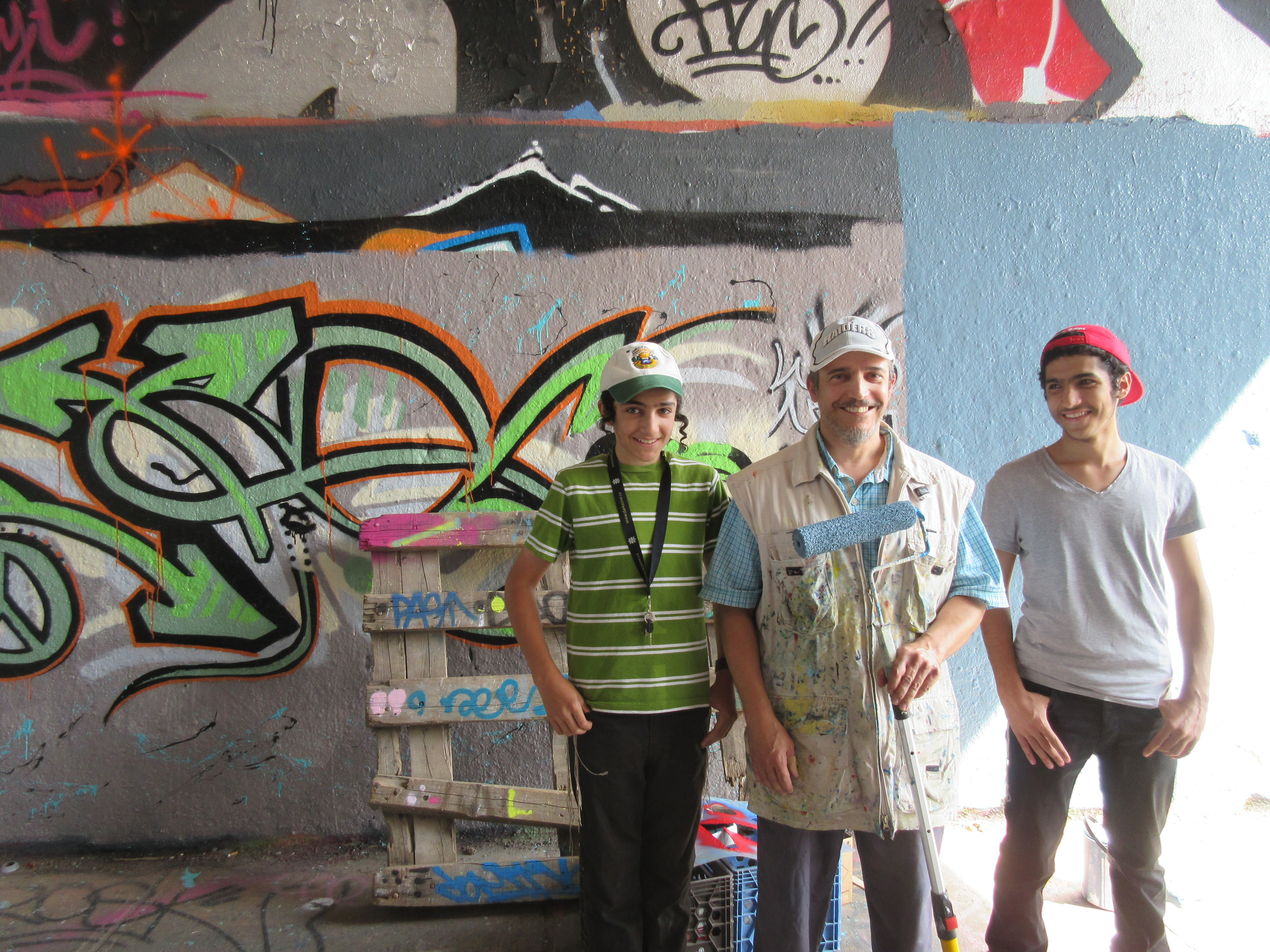 Zrey Li (center) and his graffiti helpers